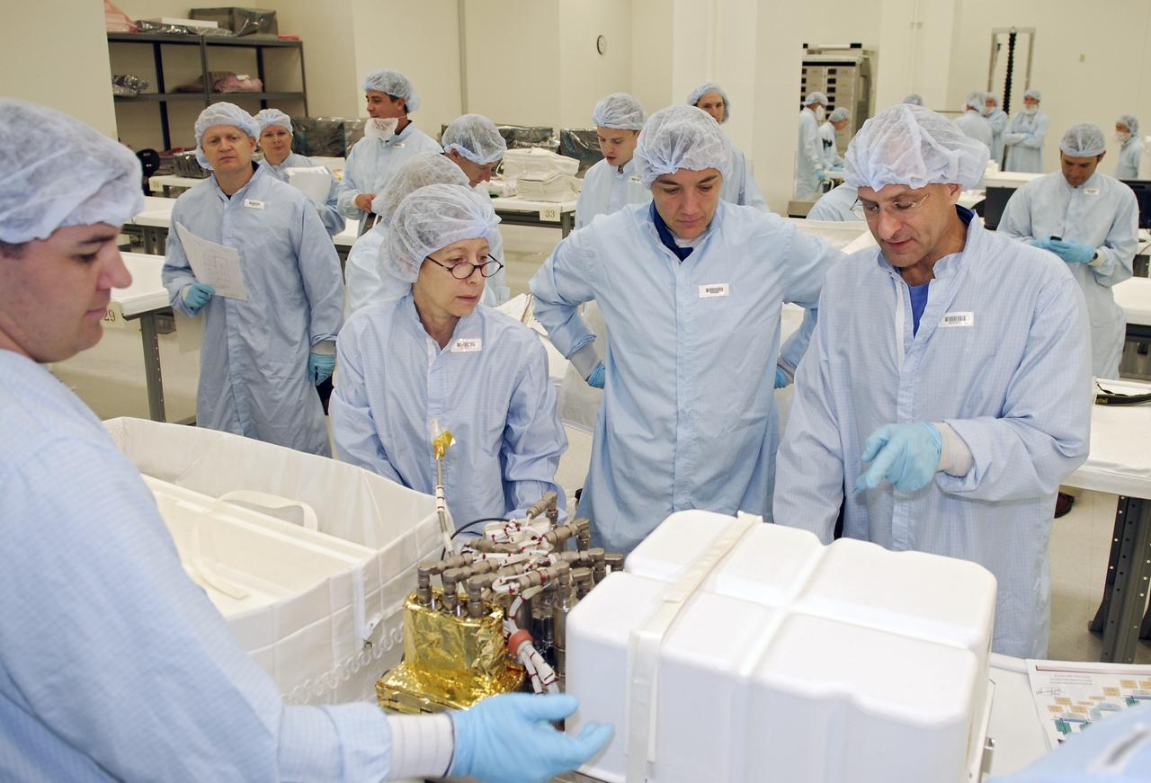 CAPE CANAVERAL, Fla. – In the Space Station Processing Facility at NASA's Kennedy Space Center, STS-126 crew members check data on equipment that will fly on the mission. From right are Mission Specialists Donald Pettit and Heidemarie M. Stefanyshyn-Piper; astronaut Marsha Ivins, who is currently assigned to the Astronaut Office; and Pilot Eric Boe. Shuttle crews frequently visit Kennedy to get hands-on experience, called a crew equipment interface test, with hardware and equipment for their missions. On STS-126, Endeavour will deliver a multi-purpose logistics module to the International Space Station. Launch is targeted for Nov. 10. Photo credit: NASA/Kim Shiflett
