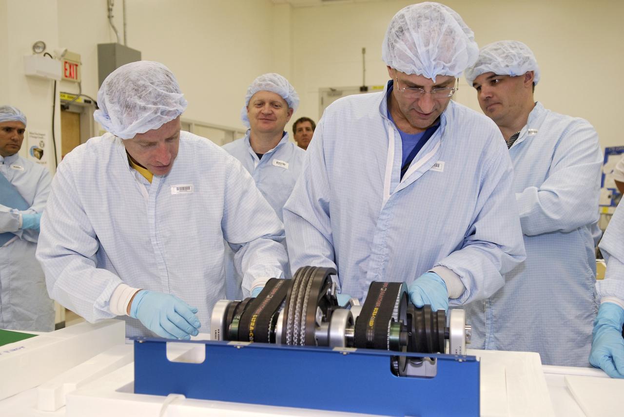 CAPE CANAVERAL, Fla.  –   In the Space Station Processing Facility at NASA's Kennedy Space Center, STS-126 crew members check data on equipment that will fly on the mission. From left are Commander Christopher Ferguson, Pilot Eric Boe, and Mission Specialist Donald Pettit.  Shuttle crews frequently visit Kennedy  to get hands-on experience, called a crew equipment interface test, with hardware and equipment for their missions.  On STS-126, Endeavour will deliver a multi-purpose logistics module to the International Space Station. Launch is targeted for Nov. 10.   Photo credit: NASA/Kim Shiflett
