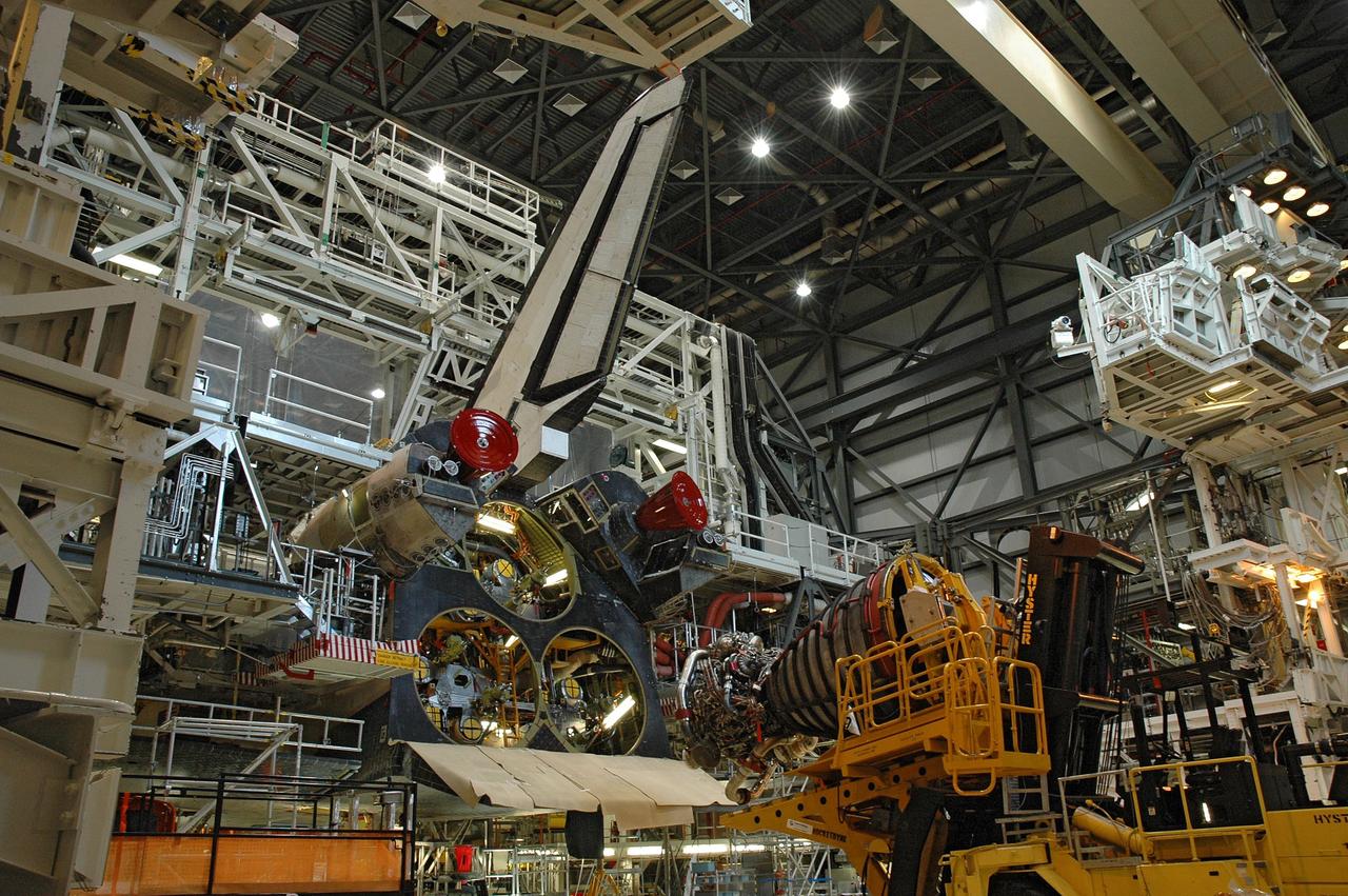 CAPE CANAVERAL, Fla.  –  In the Orbiter Processing Facility bay 2, technicians on the Hyster forklift maneuver main engine 1 for installation on space shuttle Endeavour.  The scheduled launch vehicle for the STS-126 mission, Endeavour will deliver a multi-purpose logistics module to the International Space Station. Launch is targeted for Nov. 10. Endeavour is also the backup shuttle, if needed for rescue, for the STS-125 mission in October that will make repairs on the Hubble Space Telescope.  For that purpose, it is designated STS-400.  Photo credit: NASA/Jim Grossmann