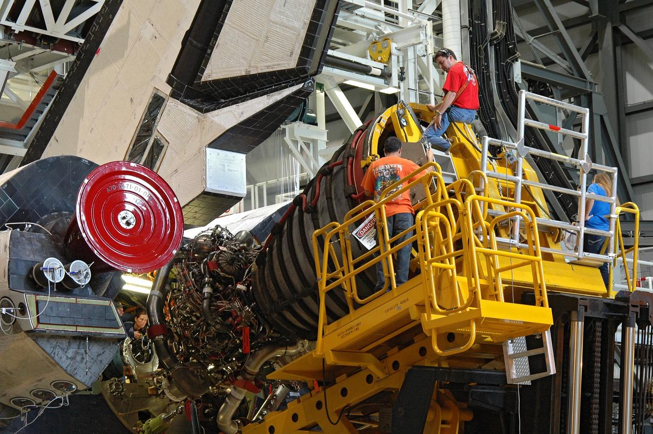 CAPE CANAVERAL, Fla.  –  In the Orbiter Processing Facility bay 2, technicians on the Hyster forklift maneuver main engine 1 for installation on space shuttle Endeavour.  The scheduled launch vehicle for the STS-126 mission, Endeavour will deliver a multi-purpose logistics module to the International Space Station. Launch is targeted for Nov. 10.  Endeavour is also the backup shuttle, if needed for rescue, for the STS-125 mission in October that will make repairs on the Hubble Space Telescope.  For that purpose, it is designated STS-400. Photo credit: NASA/Jim Grossmann