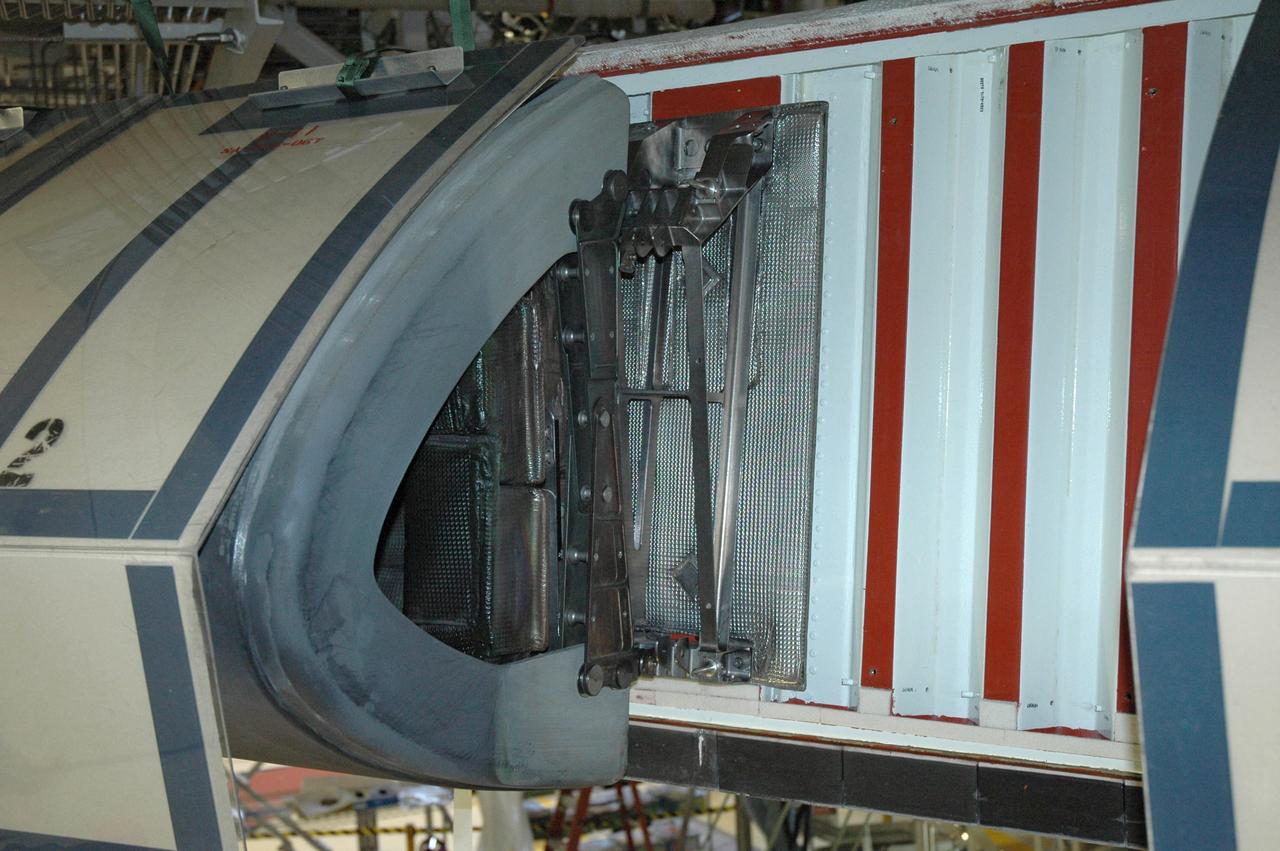 CAPE CANAVERAL, Fla. – This photo shows the leading edge of the wing on space shuttle Endeavour with an reinforced carbon-carbon panel and one insulator assembly removed. The silver assembly is the insulator. The panel is being replaced. Endeavour is the scheduled launch vehicle for the STS-126 mission and will deliver a multi-purpose logistics module to the International Space Station. Launch is targeted for Nov. 10. Endeavour is also the backup shuttle, if needed for rescue, for the STS-125 mission in October that will make repairs on the Hubble Space Telescope. For that purpose, it is designated STS-400. Photo credit: NASA/Jim Grossmann