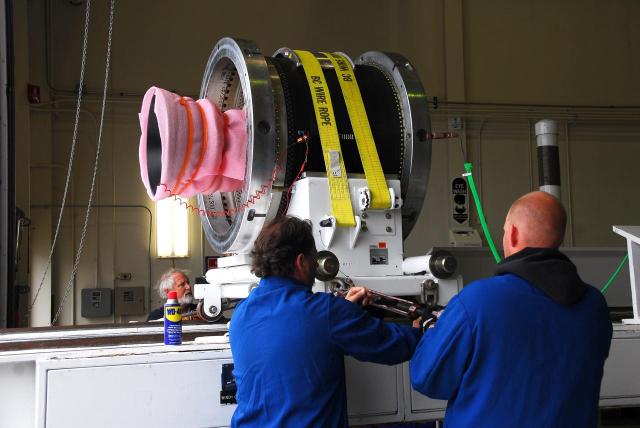 VANDENBERG AIR FORCE BASE, Calif. --   In Building 1555's west bay at Vandenberg AFB, workers secure the strapping holding the third stage of the Taurus rocket on the assembly integration trailer.  The Taurus will launch the Orbiting Carbon Observatory, or OCO, in 2009.  The OCO is a new Earth-orbiting mission sponsored by NASA's Earth System Science Pathfinder Program.  Photo credit: NASA/Randy Beaudoin