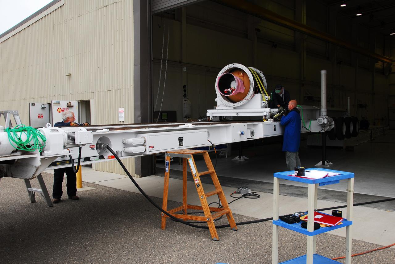 VANDENBERG AIR FORCE BASE, Calif. -- At Vandenberg AFB, workers stabilize the third stage of the Taurus rocket on the assembly integration trailer. The segment will be moved onto the stationary rails in Building 1555's west bay. The Taurus will launch the Orbiting Carbon Observatory, or OCO, in 2009. The OCO is a new Earth-orbiting mission sponsored by NASA's Earth System Science Pathfinder Program. Photo credit: NASA/Randy Beaudoin