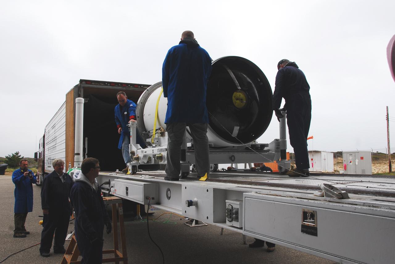 VANDENBERG AIR FORCE BASE, Calif. -- At Vandenberg AFB, the second stage of the Taurus rocket is moved out of the transportation trailer onto the assembly integration trailer. The Taurus will launch the Orbiting Carbon Observatory, or OCO, in 2009. The OCO is a new Earth-orbiting mission sponsored by NASA's Earth System Science Pathfinder Program. Photo credit: NASA/Randy Beaudoin
