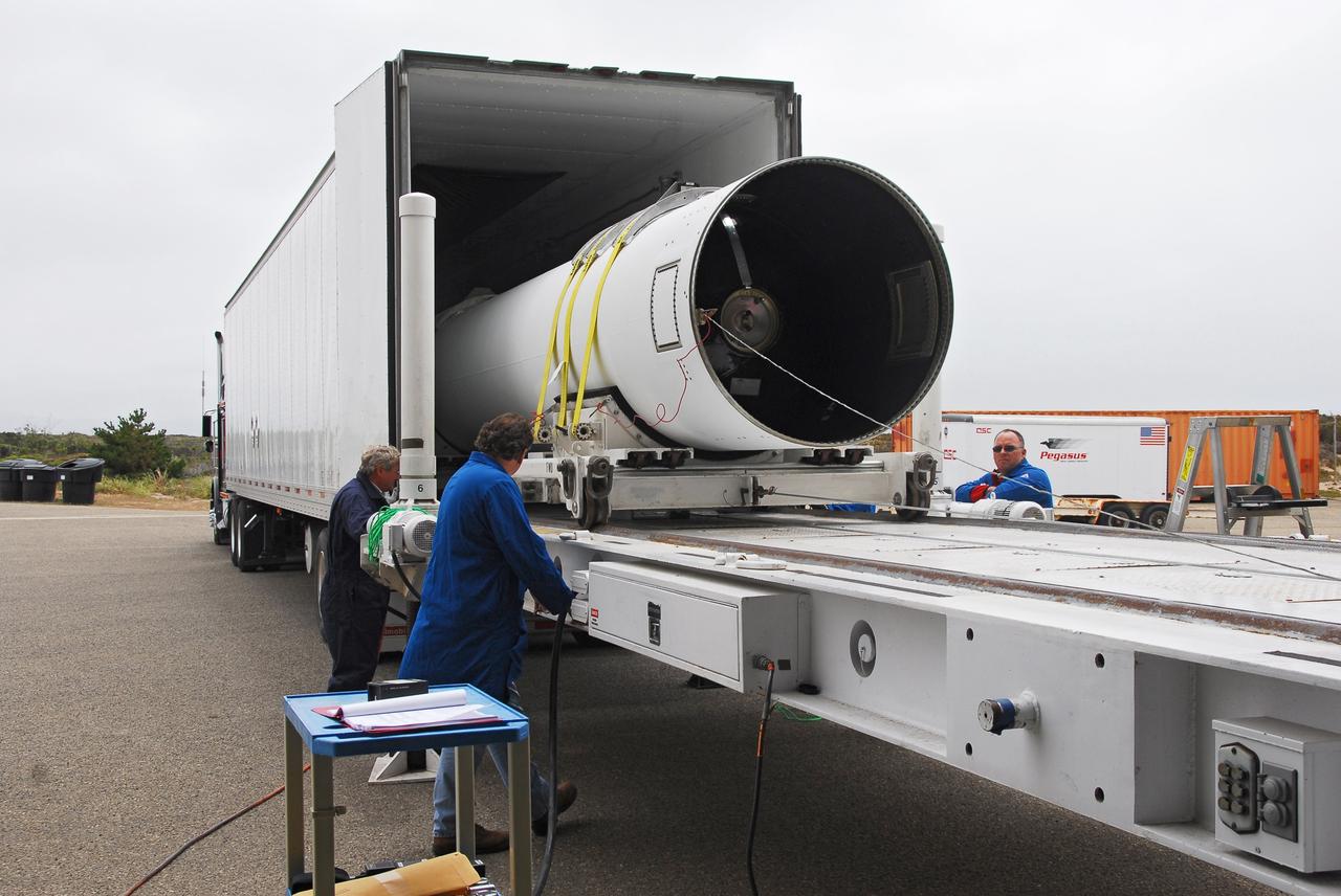 VANDENBERG AIR FORCE BASE, Calif. -- At Vandenberg AFB, the first stage of the Taurus rocket is moved out of the transportation trailer onto the assembly integration trailer. The Taurus will launch the Orbiting Carbon Observatory, or OCO, in 2009. The OCO is a new Earth-orbiting mission sponsored by NASA's Earth System Science Pathfinder Program. Photo credit: NASA/Randy Beaudoin