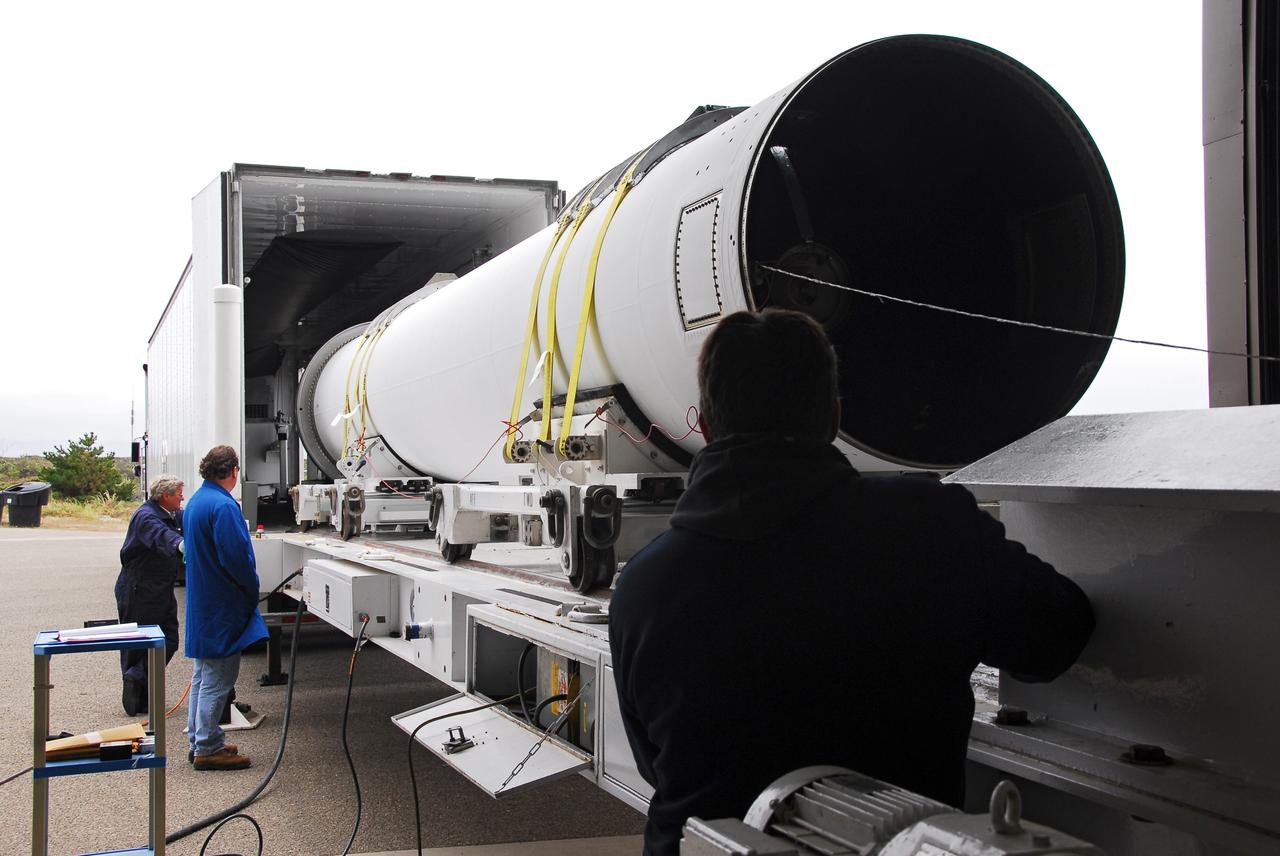 VANDENBERG AIR FORCE BASE, Calif. -- At Vandenberg AFB, the first stage of the Taurus rocket is moved out of the transportation trailer onto the assembly integration trailer. The Taurus will launch the Orbiting Carbon Observatory, or OCO, in 2009. The OCO is a new Earth-orbiting mission sponsored by NASA's Earth System Science Pathfinder Program. Photo credit: NASA/Randy Beaudoin