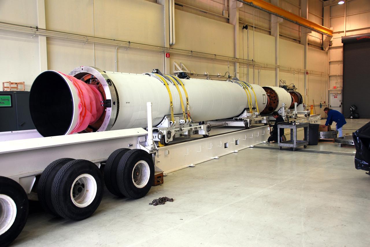 VANDENBERG AIR FORCE BASE, Calif. -- At Vandenberg AFB, the first stage of the Taurus rocket is being moved onto the stationary rails in Building 1555's west bay. The Taurus will launch the Orbiting Carbon Observatory, or OCO, in 2009. The OCO is a new Earth-orbiting mission sponsored by NASA's Earth System Science Pathfinder Program. Photo credit: NASA/Randy Beaudoin
