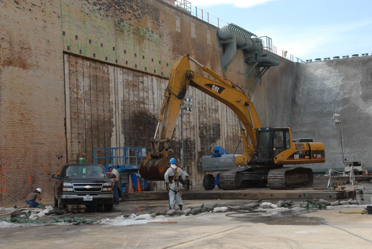 CAPE CANAVERAL, Fla. – Repairs are ongoing in the flame trench on Launch Pad 39A at NASA's Kennedy Space Center. Damage to the trench occurred during the launch of Discovery on the STS-124 mission. A 75- by 20-foot section of the east wall was destroyed and debris scattered as far as the pad perimeter fence. Repairs are expected to be completed before the targeted Oct. 8 launch of Atlantis on the STS-125 mission. Photo credit: NASA/Jack Pfaller