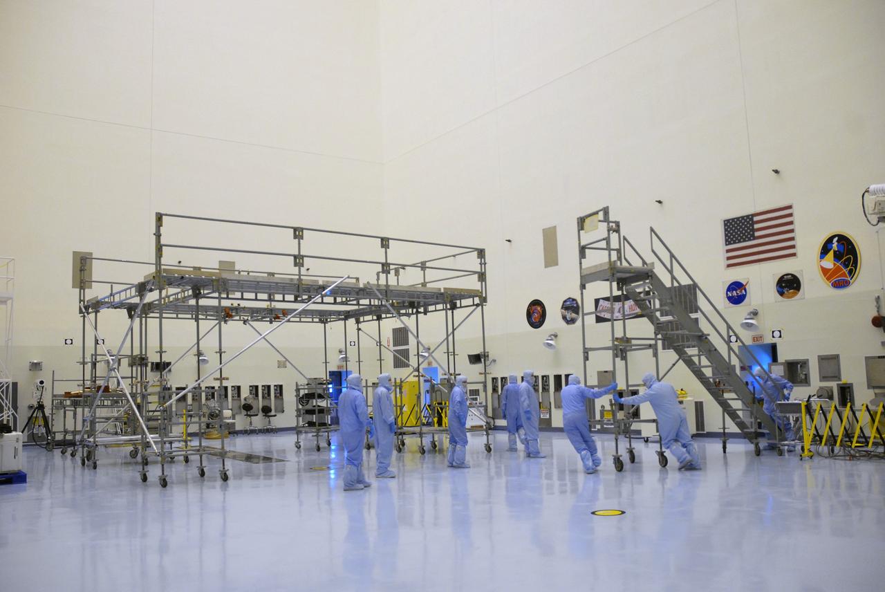 CAPE CANAVERAL, Fla. – In the Payload Hazardous Servicing Facility at NASA's Kennedy Space Center, workers move flight support system (FSS) access scaffolding that will be used to prepare the Hubble Space Telescope, or HST, carriers for the STS-125 servicing mission 4. The FSS will berth, secure and furnish power to Hubble and also contains the soft capture mechanism to be attached to the telescope. Upon completion of STS-125, the Hubble will provide even deeper and more detailed views of the Universe. The STS-125 mission will be the final space shuttle mission to the Hubble Space Telescope. Photo credit: NASA/Jack Pfaller