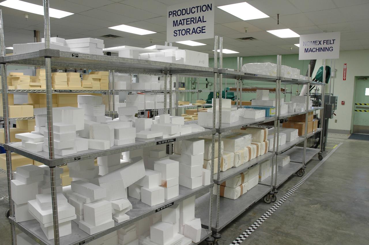 CAPE CANAVERAL, Fla. –  In the Tile Shop at NASA's Kennedy Space Center, shelves are stacked with Boeing Rigid Insulation-18, or BRI-18, tiles.  BRI-18 is the strongest material used for thermal insulation on the orbiters and, when coated to produce toughened unipiece fibrous insulation, provides a tile with extremely high-impact resistance.  It is replacing tiles on areas of the vehicle where impact risk is high.  These areas include the landing gear doors, the wing leading edge and the external tank doors.  Photo credit: NASA/Jim Grossmann