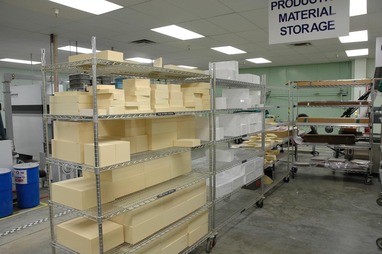 CAPE CANAVERAL, Fla. –  In the Tile Shop at NASA's Kennedy Space Center, shelves are stacked with Boeing Rigid Insulation-18, or BRI-18, tiles.  BRI-18 is the strongest material used for thermal insulation on the orbiters and, when coated to produce toughened unipiece fibrous insulation, provides a tile with extremely high-impact resistance.  It is replacing tiles on areas of the vehicle where impact risk is high.  These areas include the landing gear doors, the wing leading edge and the external tank doors.  Photo credit: NASA/Jim Grossmann