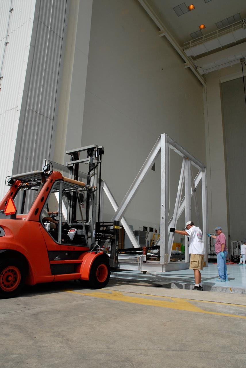 CAPE CANAVERAL, Fla. – At NASA's Kennedy Space Center, a transporter moves the thermal vacuum fixture into the Payload Hazardous Servicing Center. Space shuttle Atlantis is targeted to launch on the STS-125 mission Oct. 8. The mission crew will perform history-making, on-orbit “surgery” on two important science instruments aboard the telescope. After capturing the telescope, two teams of spacewalking astronauts will perform the repairs during five planned spacewalks. Photo credit: NASA/Jack Pfaller