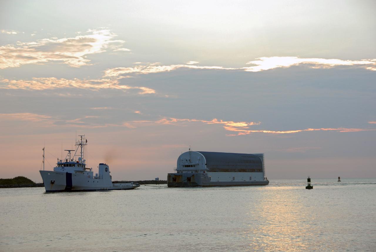 CAPE CANAVERAL, Fla. –   The external fuel tank for space shuttle Atlantis' STS-125 mission to NASA's Hubble Space Telescope arrives at Port Canaveral, Fla., towed on the Pegasus barge by a solid rocket booster retrieval ship. The tank will be towed to the turn basin in the Launch Complex 39 Area at NASA's Kennedy Space Center, offloaded and moved to the Vehicle Assembly Building.  Once inside the building, the tank will be raised to vertical, lifted and moved into a checkout cell.  Stacking of the tank and solid rocket boosters is planned to start Aug. 7.  Atlantis is targeted to launch Oct. 8.  Photo credit: NASA/Jack Pfaller