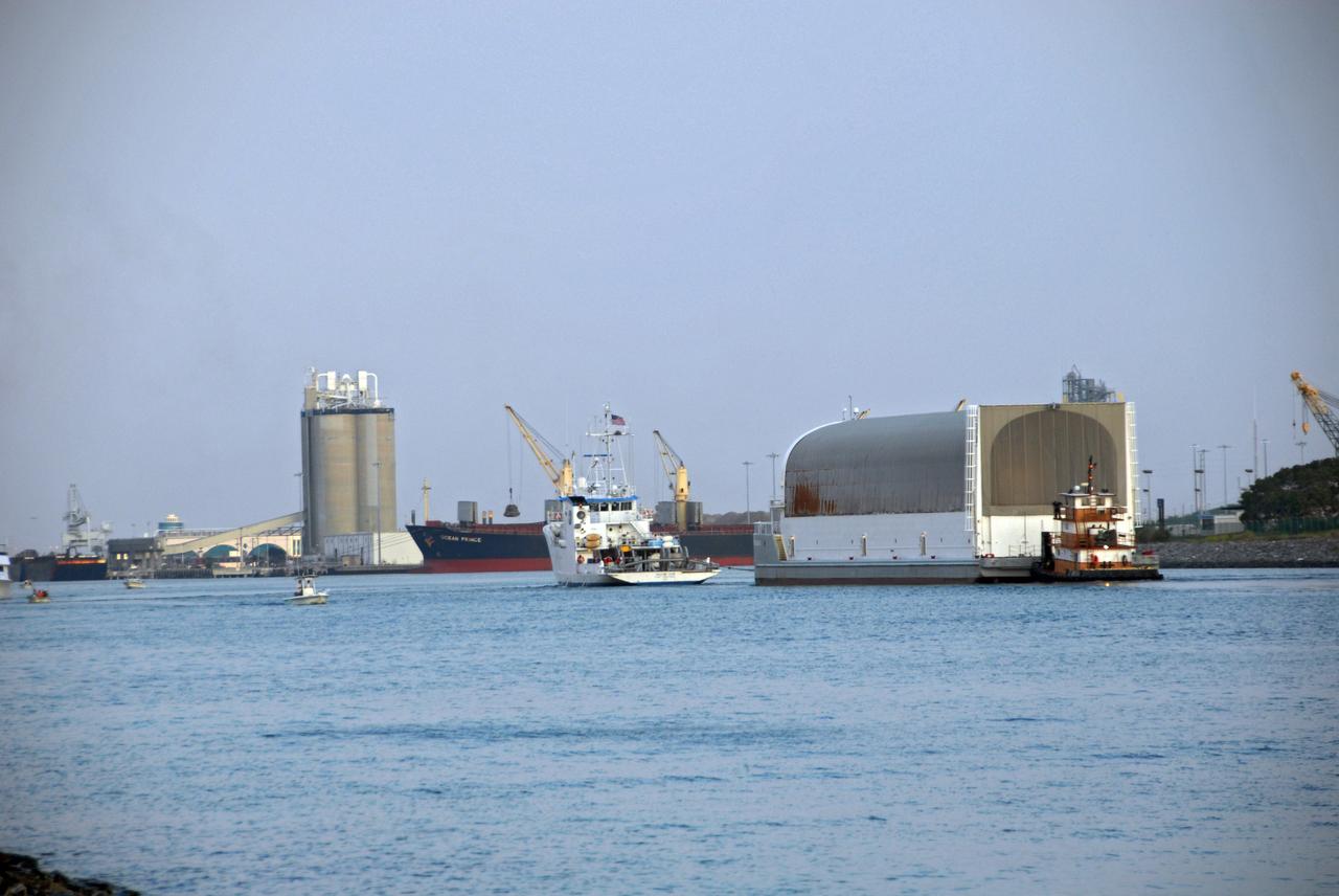 CAPE CANAVERAL, Fla. –   The external fuel tank for space shuttle Atlantis' STS-125 mission to NASA's Hubble Space Telescope arrives at Port Canaveral, Fla., towed on the Pegasus barge by a solid rocket booster retrieval ship. The tank will be towed to the turn basin in the Launch Complex 39 Area at NASA's Kennedy Space Center, offloaded and moved to the Vehicle Assembly Building.  Once inside the building, the tank will be raised to vertical, lifted and moved into a checkout cell.  Stacking of the tank and solid rocket boosters is planned to start Aug. 7.  Atlantis is targeted to launch Oct. 8.  Photo credit: NASA/Jack Pfaller