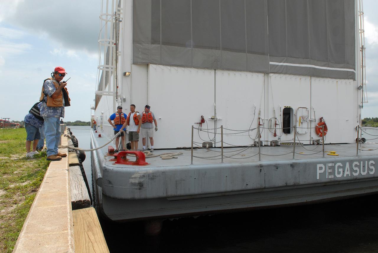 CAPE CANAVERAL, Fla. –   The Pegasus barge carrying the external tank for space shuttle Atlantis' STS-125 mission to NASA's Hubble Space Telescope is tied to the dock in the turn basin in the Launch Complex 39 Area of NASA's Kennedy Space Center.  The tank will offloaded and moved to the Vehicle Assembly Building.   Once inside the building, the tank will be raised to vertical, lifted and moved into a checkout cell.  Stacking of the tank and solid rocket boosters is planned to start Aug. 7.  Atlantis is targeted to launch Oct. 8.  Photo credit: NASA/Jack Pfaller