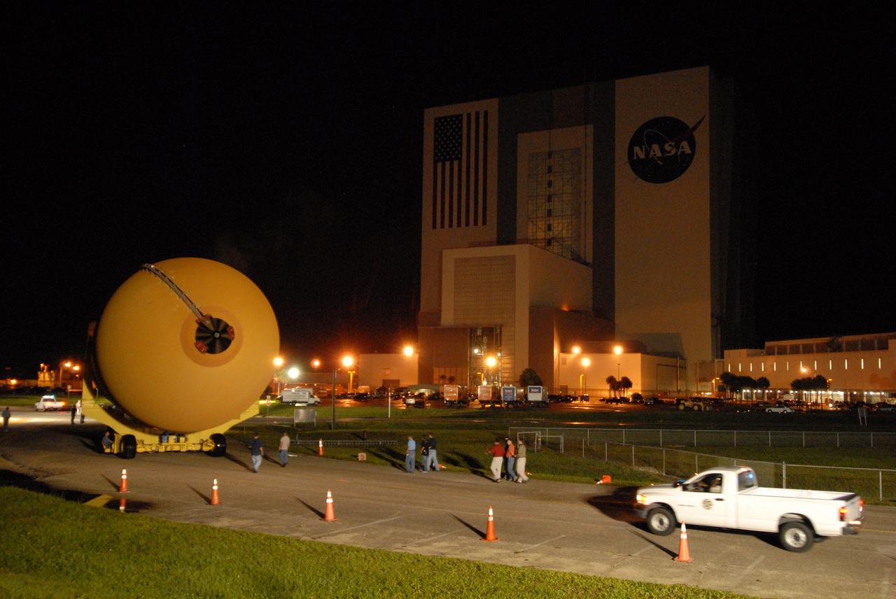 CAPE CANAVERAL, Fla. –  The external tank for space shuttle Atlantis' STS-125 mission to NASA's Hubble Space Telescope makes the turn toward the Vehicle Assembly Building at NASA's Kennedy Space Center.  The tank arrived at the turn basin earlier in the day aboard the Pegasus barge.  Inside the building, the tank will be raised to vertical, lifted and moved into a checkout cell.  Stacking of the tank and solid rocket boosters is scheduled for Aug. 7.  Atlantis is targeted to launch Oct. 8.  Photo credit: NASA/Amanda Diller