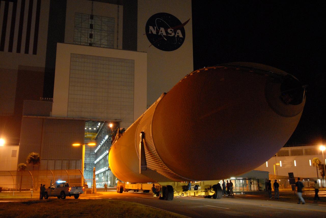 CAPE CANAVERAL, Fla. – The external tank for space shuttle Atlantis' STS-125 mission to NASA's Hubble Space Telescope moves toward the open door of the Vehicle Assembly Building at NASA's Kennedy Space Center. The tank arrived at the turn basin earlier in the day aboard the Pegasus barge. Inside the building, the tank will be raised to vertical, lifted and moved into a checkout cell. Stacking of the tank and solid rocket boosters is scheduled for Aug. 7. Atlantis is targeted to launch Oct. 8. Photo credit: NASA/Amanda Diller