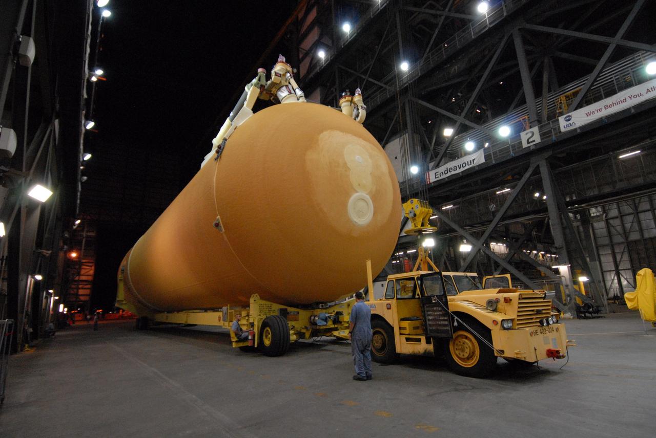 CAPE CANAVERAL, Fla. –  The external tank for space shuttle Atlantis' STS-125 mission to NASA's Hubble Space Telescope comes to a stop in the transfer aisle of the Vehicle Assembly Building at NASA's Kennedy Space Center.  The tank arrived at the turn basin earlier in the day aboard the Pegasus barge. Inside the building, the tank will be raised to vertical, lifted and moved into a checkout cell.  Stacking of the tank and solid rocket boosters is scheduled for Aug. 7.  Atlantis is targeted to launch Oct. 8.  Photo credit: NASA/Amanda Diller