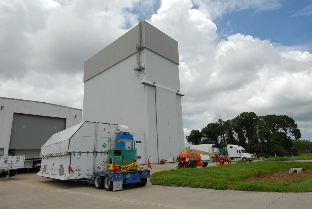 CAPE CANAVERAL, Fla. –  A container with flight hardware for space shuttle Atlantis' STS-125 mission to NASA's Hubble Space Telescope is moved toward the airlock in the Payload Hazardous Servicing Facility at NASA's Kennedy Space Center.  In the facility, the hardware will be prepared for its targeted October launch.  The payload carriers will be prepared for the integration of telescope science instruments, both internal and external replacement components, as well as the flight support equipment to be used by the astronauts during the servicing mission.  The three payload carriers or pallets are the Flight Support System, the Super Lightweight Interchangeable Carrier and the Orbital Replacement Unit Carrier.  At the end of July, a fourth and final carrier, the Multi-Use Lightweight Equipment carrier will join the others in the Payload Hazardous Servicing Facility where the Hubble payload is being prepared for launch. Photo credit: NASA/Jack Pfaller