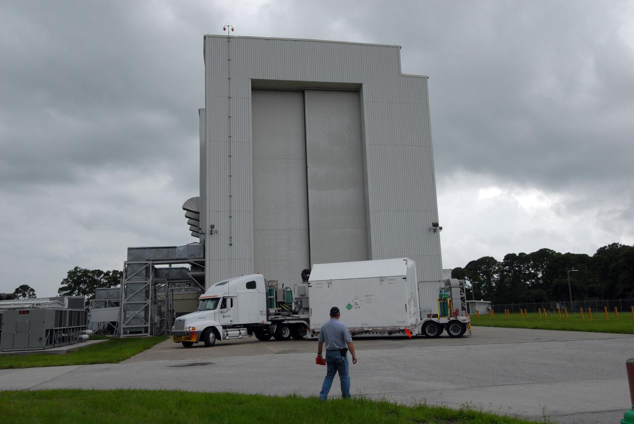 CAPE CANAVERAL, Fla. –  Another container with flight hardware for space shuttle Atlantis' STS-125 mission to NASA's Hubble Space Telescope is moved toward the airlock in the Payload Hazardous Servicing Facility at NASA's Kennedy Space Center.  In the facility, the hardware will be prepared for its targeted October launch.  The payload carriers will be prepared for the integration of telescope science instruments, both internal and external replacement components, as well as the flight support equipment to be used by the astronauts during the servicing mission.  The three payload carriers or pallets are the Flight Support System, the Super Lightweight Interchangeable Carrier and the Orbital Replacement Unit Carrier.  At the end of July, a fourth and final carrier, the Multi-Use Lightweight Equipment carrier will join the others in the Payload Hazardous Servicing Facility where the Hubble payload is being prepared for launch. Photo credit: NASA/Jack Pfaller