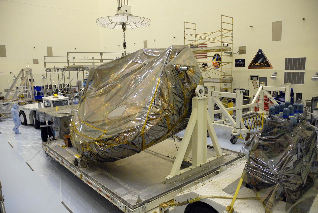 CAPE CANAVERAL, Fla. –  In the Payload Hazardous Servicing Facility at NASA's Kennedy Space Center, workers begin to attach a crane to part of the ground support equipment for the STS-125 Hubble Servicing Mission.  The GSE are carriers, or pallets, that will hold equipment in space shuttle Atlantis’ payload bay.  This carrier will be moved to a work stand.  The carriers will be prepared for the integration of telescope science instruments, both internal and external replacement components, as well as the flight support equipment to be used by the astronauts during the servicing mission.  The three payload carriers or pallets are the Flight Support System, the Super Lightweight Interchangeable Carrier and the Orbital Replacement Unit Carrier.  At the end of July, a fourth and final carrier, the Multi-Use Lightweight Equipment carrier will join the others in the Payload Hazardous Servicing Facility where the Hubble payload is being prepared for launch. Photo credit: NASA/Cory Huston