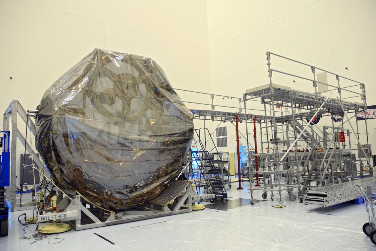 CAPE CANAVERAL, Fla. –   In the Payload Hazardous Servicing Facility, a carrier for the STS-125 Hubble Servicing Mission is on a work stand waiting to be moved to the scaffolding at right. The carrier, or pallet, will hold the flight support system equipment in space shuttle Atlantis’ payload bay. This and other carriers will be prepared for the integration of telescope science instruments, both internal and external replacement components, as well as the flight support equipment to be used by the astronauts during the servicing mission.  The three payload carriers are the Flight Support System, the Super Lightweight Interchangeable Carrier and the Orbital Replacement Unit Carrier.  At the end of July, a fourth and final carrier, the Multi-Use Lightweight Equipment carrier will join the others in the Payload Hazardous Servicing Facility where the Hubble payload is being prepared for the targeted Oct . 8 launch.  Photo credit: NASA/Jack Pfaller