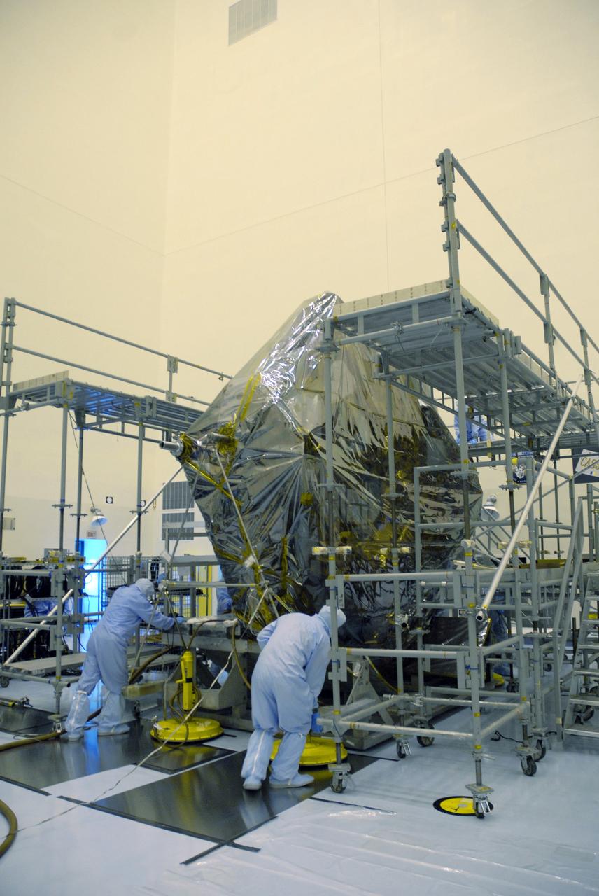 CAPE CANAVERAL, Fla. –  In the Payload Hazardous Servicing Facility, workers move a carrier for the STS-125 Hubble Servicing Mission to scaffolding.  The carrier, or pallet, will hold the flight support system equipment in space shuttle Atlantis’ payload bay.  This and other carriers will be prepared for the integration of telescope science instruments, both internal and external replacement components, as well as the flight support equipment to be used by the astronauts during the servicing mission.  The three payload carriers are the Flight Support System, the Super Lightweight Interchangeable Carrier and the Orbital Replacement Unit Carrier.  At the end of July, a fourth and final carrier, the Multi-Use Lightweight Equipment carrier will join the others in the Payload Hazardous Servicing Facility where the Hubble payload is being prepared for the targeted Oct . 8 launch.  Photo credit: NASA/Jack Pfaller
