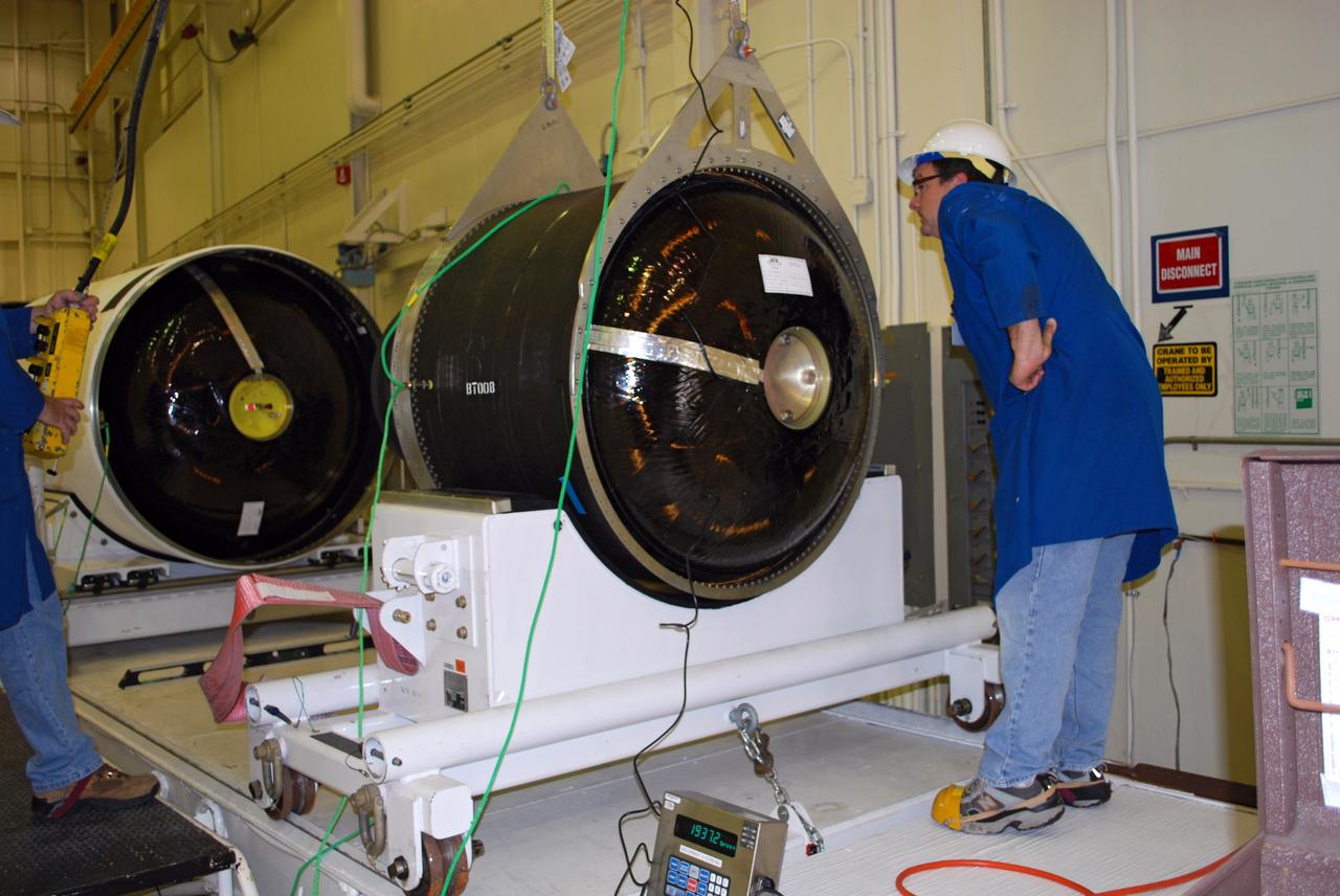 VANDENBERG AIR FORCE BASE, Calif. -- An Alliant motor designated for Stage 3 of a Taurus rocket is weighed by Orbital Sciences workers in Building 1555 at Vandenberg AFB.  The Taurus will launch the Orbiting Carbon Observatory, or OCO, in January 2009. The OCO is a new Earth-orbiting mission sponsored by NASA's Earth System Science Pathfinder Program.  OCO will provide space-based observations of atmospheric carbon dioxide (CO2), the principal human-initiated driver of climate change. Mature technologies will be used to address NASA's highest priority carbon cycle measurement requirement.  NASA's Jet Propulsion Laboratory leads the OCO effort. Orbital Sciences Corporation is providing the Taurus launch vehicle; Hamilton Sundstrand Sensor Systems, the OCO spacecraft.  Photo credit: NASA/Randy Beaudoin