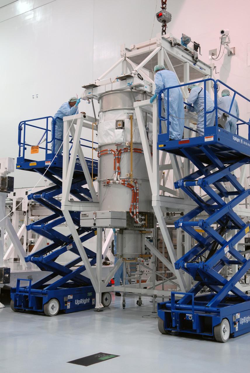 CAPE CANAVERAL, Fla. –  In the Space Station Processing Facility at NASA's Kennedy Space Center, workers prepare to move the final solar array wing for the International Space Station for installation on the S6 truss element. Scheduled to launch on the STS-119 mission, space shuttle Discovery will carry the S6 truss segment to complete the 361-foot-long backbone of the International Space Station. The truss includes the fourth pair of solar array wings and electronics that convert sunlight to power for the orbiting laboratory. Launch is targeted for Feb. 12, 2009.  Photo credit: NASA/Troy Cryder