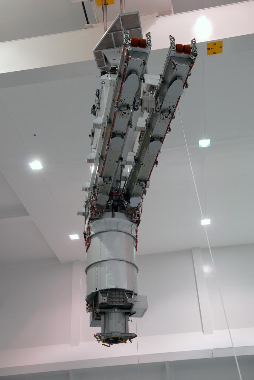 CAPE CANAVERAL, Fla. – In the Space Station Processing Facility at NASA's Kennedy Space Center, the final solar array wing for the International Space Station is moved into position for installation onto the S6 truss element. Scheduled to launch on the STS-119 mission, space shuttle Discovery will carry the S6 truss segment to complete the 361-foot-long backbone of the International Space Station. The truss includes the fourth pair of solar array wings and electronics that convert sunlight to power for the orbiting laboratory. Launch is targeted for Feb. 12, 2009. Photo credit: NASA/Troy Cryder