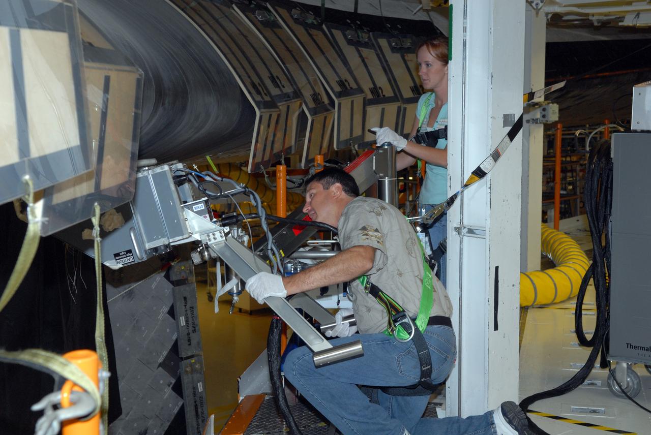 CAPE CANAVERAL, Fla. – Inside Orbiter Processing Facility 2 at NASA's Kennedy Space Center, United Space Alliance technicians inspect the reinforced carbon-carbon, or RCC, panels on Endeavour's wing leading edge using thermography to detect structural abnormalities. Endeavour will deliver a multi-purpose logistics module to the International Space Station on its STS-126 mission. Launch is targeted for Nov. 10. Photo credit: NASA/Amanda Diller