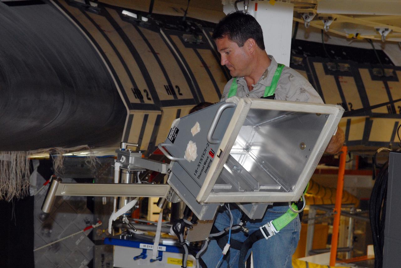 CAPE CANAVERAL, Fla. – Inside Orbiter Processing Facility 2 at NASA's Kennedy Space Center, a United Space Alliance technician inspects the reinforced carbon-carbon, or RCC, panels on Endeavour's wing leading edge using thermography to detect structural abnormalities. Endeavour will deliver a multi-purpose logistics module to the International Space Station on its STS-126 mission. Launch is targeted for Nov. 10. Photo credit: NASA/Amanda Diller