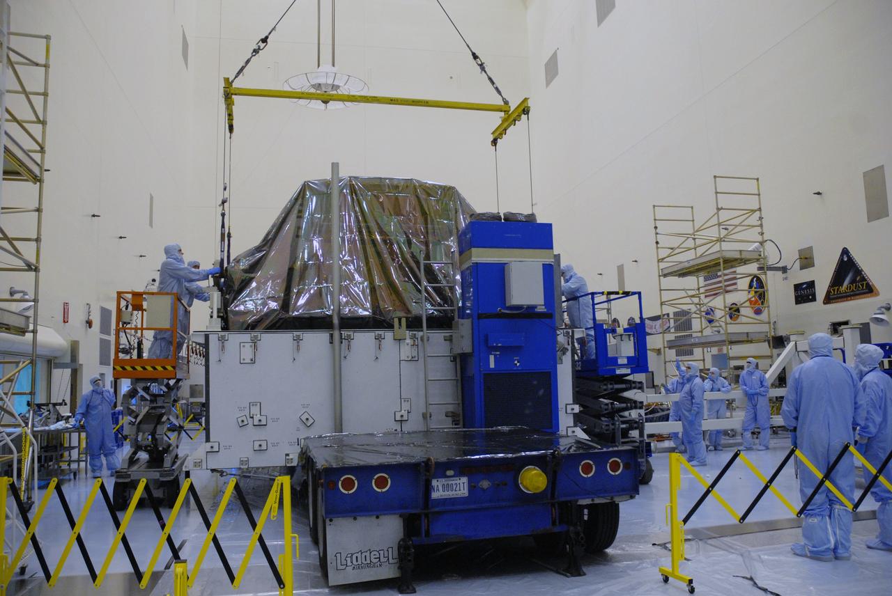 CAPE CANAVERAL, Fla. – In the high bay of the Payload Hazardous Servicing Facility at NASA's Kennedy Space Center, workers from NASA's Goddard Space Flight Center begin to lift the Flight Support System for the Hubble Space Telescope from its transportation canister. The Flight Support System, or FSS, is one of four carriers supporting hardware for space shuttle Atlantis' STS-125 mission to service the telescope. The Super Lightweight Interchangeable Carrier, or SLIC, and the Orbital Replacement Unit Carrier, or ORUC, have also arrived at Kennedy. The Multi-Use Lightweight Equipment carrier will be delivered in late July. The carriers will be prepared for the integration of telescope science instruments, both internal and external replacement components, as well as the flight support equipment to be used by the astronauts during the Hubble servicing mission, targeted for launch Oct. 8. Photo credit: NASA/Jack Pfaller