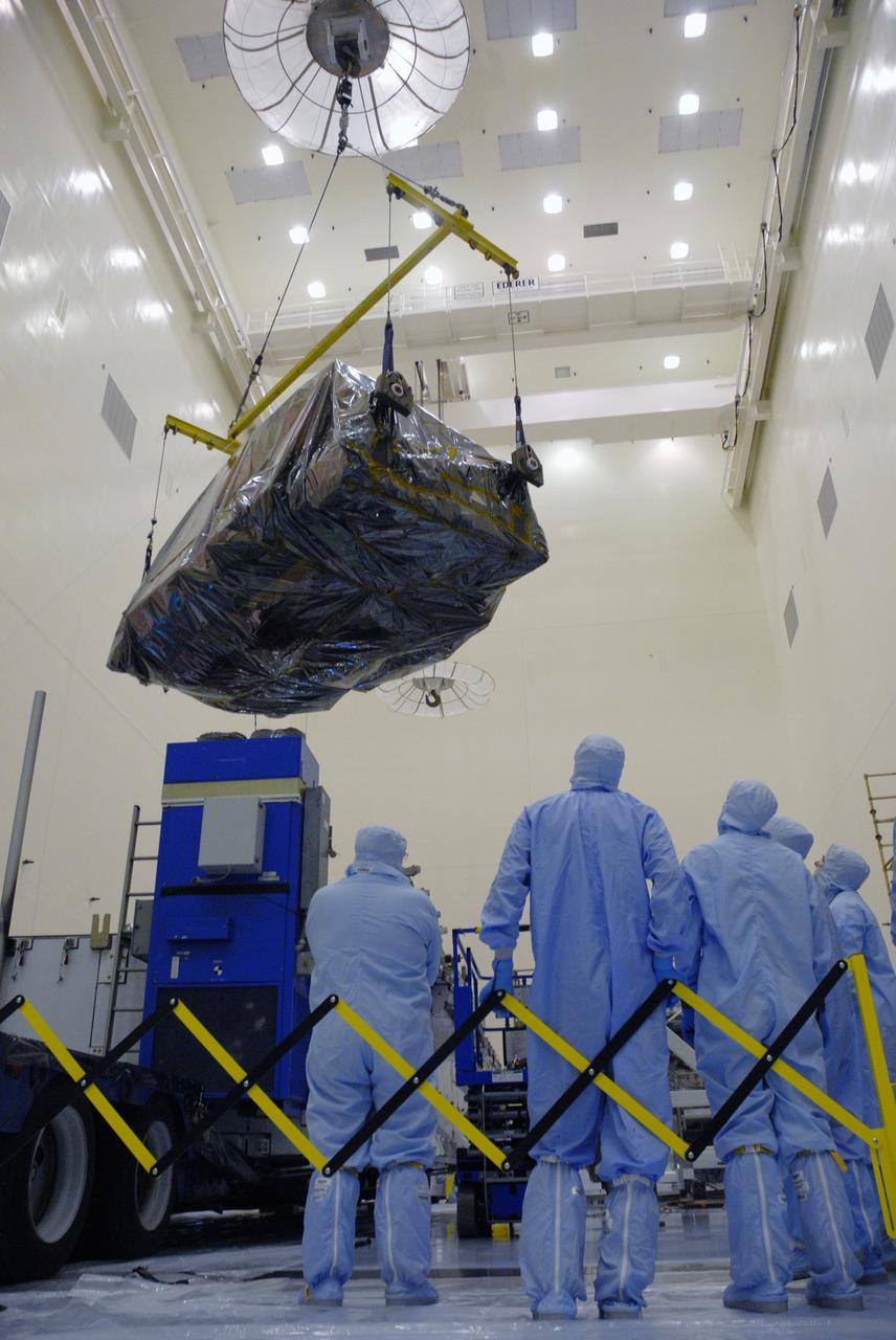 CAPE CANAVERAL, Fla. – In the high bay of the Payload Hazardous Servicing Facility at NASA's Kennedy Space Center, the Flight Support System for the Hubble Space Telescope is lifted from its transportation canister under the supervision of workers from NASA's Goddard Space Flight Center. The Flight Support System, or FSS, is one of four carriers supporting hardware for space shuttle Atlantis' STS-125 mission to service the telescope. The Super Lightweight Interchangeable Carrier, or SLIC, and the Orbital Replacement Unit Carrier, or ORUC, have also arrived at Kennedy. The Multi-Use Lightweight Equipment carrier will be delivered in late July. The carriers will be prepared for the integration of telescope science instruments, both internal and external replacement components, as well as the flight support equipment to be used by the astronauts during the Hubble servicing mission, targeted for launch Oct. 8. Photo credit: NASA/Jack Pfaller