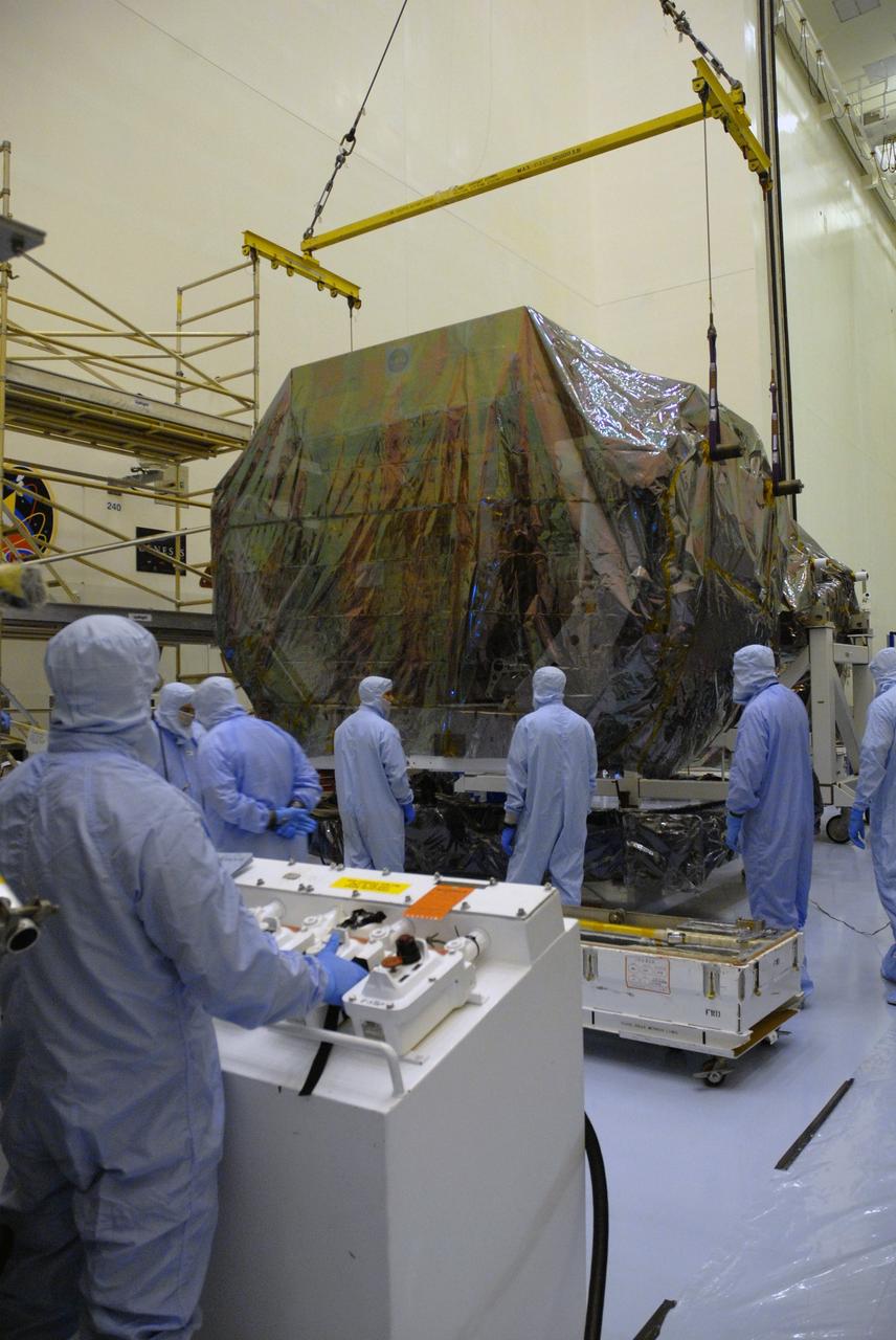 CAPE CANAVERAL, Fla. – In the high bay of the Payload Hazardous Servicing Facility at NASA's Kennedy Space Center, the Orbital Replacement Unit Carrier for the Hubble Space Telescope is positioned on a work platform by workers from NASA's Goddard Space Flight Center.  The Orbital Replacement Unit Carrier, or ORUC, is one of four carriers supporting hardware for space shuttle Atlantis' STS-125 mission to service the telescope. The Super Lightweight Interchangeable Carrier, or SLIC, and the Flight Support System, or FSS, have also arrived at Kennedy. The Multi-Use Lightweight Equipment carrier will be delivered in late July. The carriers will be prepared for the integration of telescope science instruments, both internal and external replacement components, as well as the flight support equipment to be used by the astronauts during the Hubble servicing mission, targeted for launch Oct. 8. Photo credit: NASA/Jack Pfaller