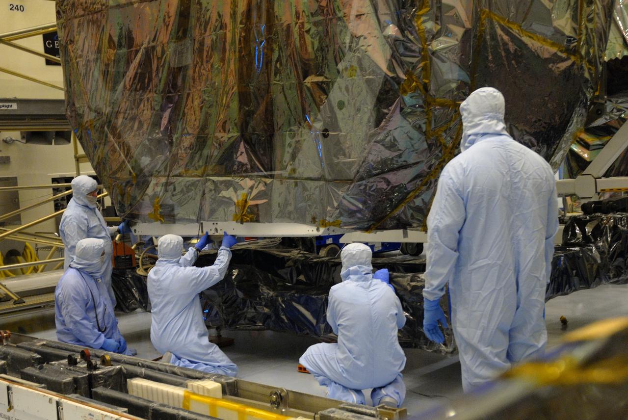 CAPE CANAVERAL, Fla. – In the high bay of the Payload Hazardous Servicing Facility at NASA's Kennedy Space Center, the Orbital Replacement Unit Carrier for the Hubble Space Telescope is secured on a work platform by workers from NASA's Goddard Space Flight Center.  The Orbital Replacement Unit Carrier, or ORUC, is one of four carriers supporting hardware for space shuttle Atlantis' STS-125 mission to service the telescope. The Super Lightweight Interchangeable Carrier, or SLIC, and the Flight Support System, or FSS, have also arrived at Kennedy. The Multi-Use Lightweight Equipment carrier will be delivered in late July. The carriers will be prepared for the integration of telescope science instruments, both internal and external replacement components, as well as the flight support equipment to be used by the astronauts during the Hubble servicing mission, targeted for launch Oct. 8. Photo credit: NASA/Jack Pfaller