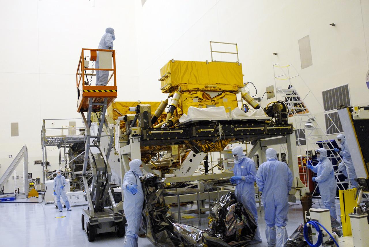 CAPE CANAVERAL, Fla. – In the high bay of the Payload Hazardous Servicing Facility at NASA's Kennedy Space Center, the Super Lightweight Interchangeable Carrier for the Hubble Space Telescope is unwrapped and ready for final processing for launch.  The Super Lightweight Interchangeable Carrier, or SLIC, is one of four carriers supporting hardware for space shuttle Atlantis' STS-125 mission to service the telescope. The Orbital Replacement Unit Carrier, or ORUC, and the Flight Support System, or FSS, have also arrived at Kennedy. The Multi-Use Lightweight Equipment carrier will be delivered in late July. The carriers will be prepared for the integration of telescope science instruments, both internal and external replacement components, as well as the flight support equipment to be used by the astronauts during the Hubble servicing mission, targeted for launch Oct. 8. Photo credit: NASA/Jack Pfaller