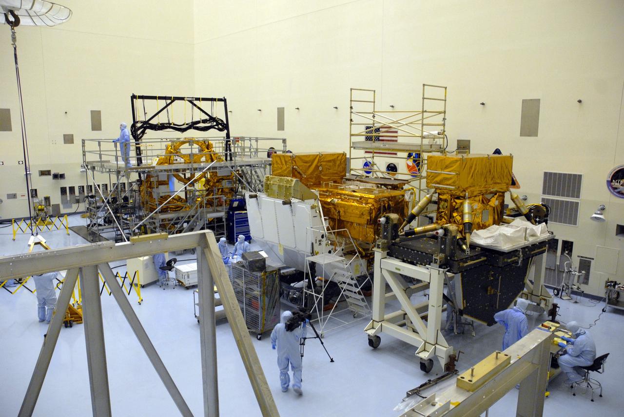 CAPE CANAVERAL, Fla. -- In the high bay of the Payload Hazardous Servicing Facility at NASA's Kennedy Space Center, this elevated view shows three carriers undergoing processing for space shuttle Atlantis' STS-125 mission to service the Hubble Space Telescope. From left are the Flight Support System or FSS, the Orbital Replacement Unit Carrier or ORUC, and the Super Lightweight Interchangeable Carrier or SLIC. The Multi-Use Lightweight Equipment carrier will be delivered in early August. The carriers will be prepared for the integration of telescope science instruments, both internal and external replacement components, as well as the flight support equipment to be used by the astronauts during the Hubble servicing mission, targeted for launch Oct. 8. Photo credit: NASA/Jack Pfaller