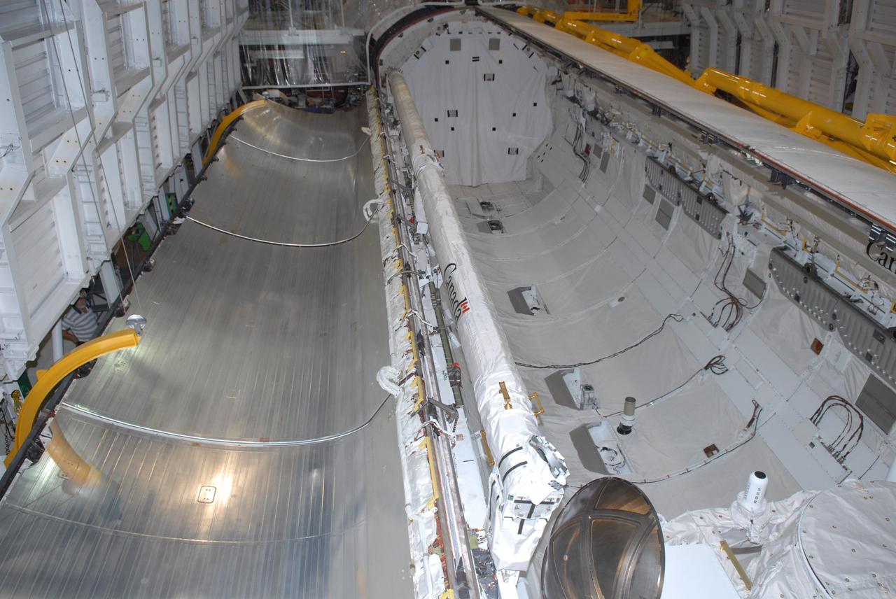 CAPE CANAVERAL, Fla. – In Orbiter Processing Facility 1 at NASA's Kennedy Space Center, space shuttle Atlantis' payload bay has been thoroughly cleaned and is ready to receive the carriers transporting the instruments and equipment needed to service the Hubble Space Telescope. Atlantis is targeted to launch Oct. 8 on the STS-125 mission to service Hubble. The mission crew will perform history-making, on-orbit “surgery” on two important science instruments aboard the telescope. After capturing the telescope, two teams of spacewalking astronauts will perform the repairs during five planned spacewalks. Photo credit: NASA/Jack Pfaller