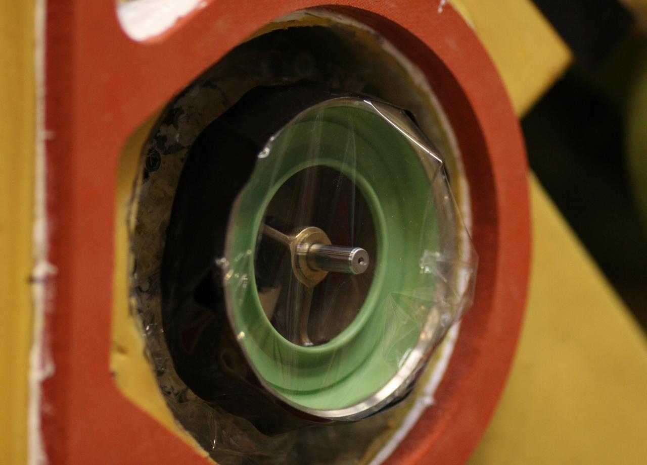 CAPE CANAVERAL, Fla. – A close up view of the quick disconnect system on Atlantis’ external tank inside a test cell in the Vehicle Assembly Building at NASA's Kennedy Space Center. Technicians prepared to replace a valve after small dings were found on the sealing surface of the quick disconnect system that handles liquid-hydrogen fuel for the shuttle’s three main engines. The tank will be attached to the twin solid rocket boosters on Aug. 3 for the STS-125 mission, the fifth and final shuttle servicing mission to NASA’s Hubble Space Telescope. During the mission, the crew will install new instruments on the telescope, including the Cosmic Origins Spectrograph and the Wide Field Camera 3. A refurbished Fine Guidance Sensor will replace one unit of three now onboard. Mission specialists will also install new gyroscopes, batteries and thermal blankets on the telescope. Launch is targeted for Oct. 8. Photo credit: NASA/Dimitri Gerondidakis