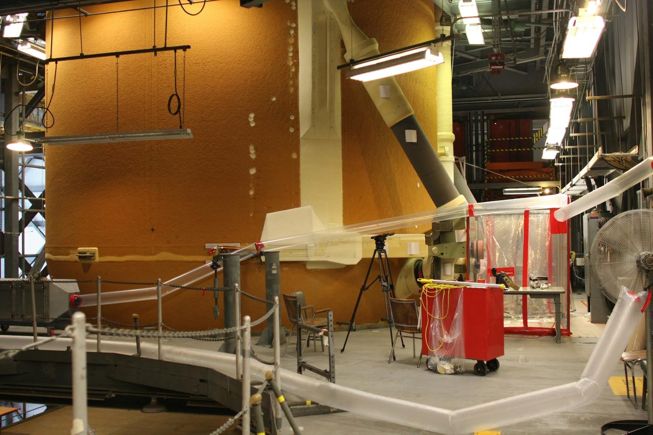 CAPE CANAVERAL, Fla. – Inside the Vehicle Assembly Building at NASA's Kennedy Space Center, a portion of Atlantis’ external tank is sealed to prevent contamination so that technicians can replace a valve on Atlantis’ external tank after small dings were found on the sealing surface of the quick disconnect system that handles liquid-hydrogen fuel for the shuttle’s three main engines. The tank will be attached to the twin solid rocket boosters on Aug. 3 for the STS-125 mission, the fifth and final shuttle servicing mission to NASA’s Hubble Space Telescope. During the mission, the crew will install new instruments on the telescope, including the Cosmic Origins Spectrograph and the Wide Field Camera 3. A refurbished Fine Guidance Sensor will replace one unit of three now onboard. Mission specialists will also install new gyroscopes, batteries and thermal blankets on the telescope. Launch is targeted for Oct. 8. Photo credit: NASA/Dimitri Gerondidakis