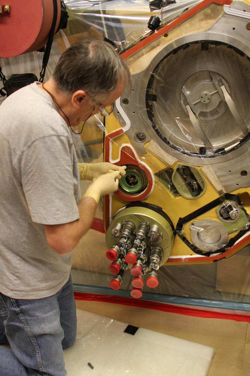CAPE CANAVERAL, Fla. – Inside the Vehicle Assembly Building at NASA’s Kennedy Space Center, a technician removes a valve from Atlantis’ external tank after small dings were found on the sealing surface of the quick disconnect system that handles liquid-hydrogen fuel for the shuttle’s three main engines. The tank will be attached to the twin solid rocket boosters on Aug. 3 for the STS-125 mission, the fifth and final shuttle servicing mission to NASA’s Hubble Space Telescope. During the mission, the crew will install new instruments on the telescope, including the Cosmic Origins Spectrograph and the Wide Field Camera 3. A refurbished Fine Guidance Sensor will replace one unit of three now onboard. Mission specialists will also install new gyroscopes, batteries and thermal blankets on the telescope. Launch is targeted for Oct. 8. Photo credit: NASA/Dimitri Gerondidakis