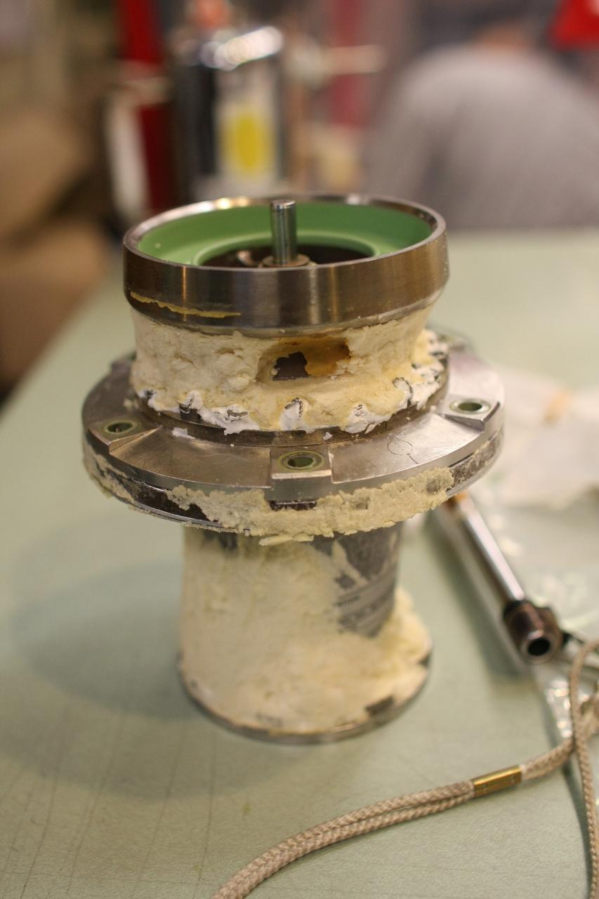 CAPE CANAVERAL, Fla. – A close up view of the valve removed from Atlantis’ external tank inside the Vehicle Assembly Building at NASA’s Kennedy Space Center. Technicians removed the valve after small dings were found on the sealing surface of the quick disconnect system that handles liquid-hydrogen fuel for the shuttle’s three main engines. The tank will be attached to the twin solid rocket boosters on Aug. 3 for the STS-125 mission, the fifth and final shuttle servicing mission to NASA’s Hubble Space Telescope. During the mission, the crew will install new instruments on the telescope, including the Cosmic Origins Spectrograph and the Wide Field Camera 3. A refurbished Fine Guidance Sensor will replace one unit of three now onboard. Mission specialists will also install new gyroscopes, batteries and thermal blankets on the telescope. Launch is targeted for Oct. 8. Photo credit: NASA/Dimitri Gerondidakis