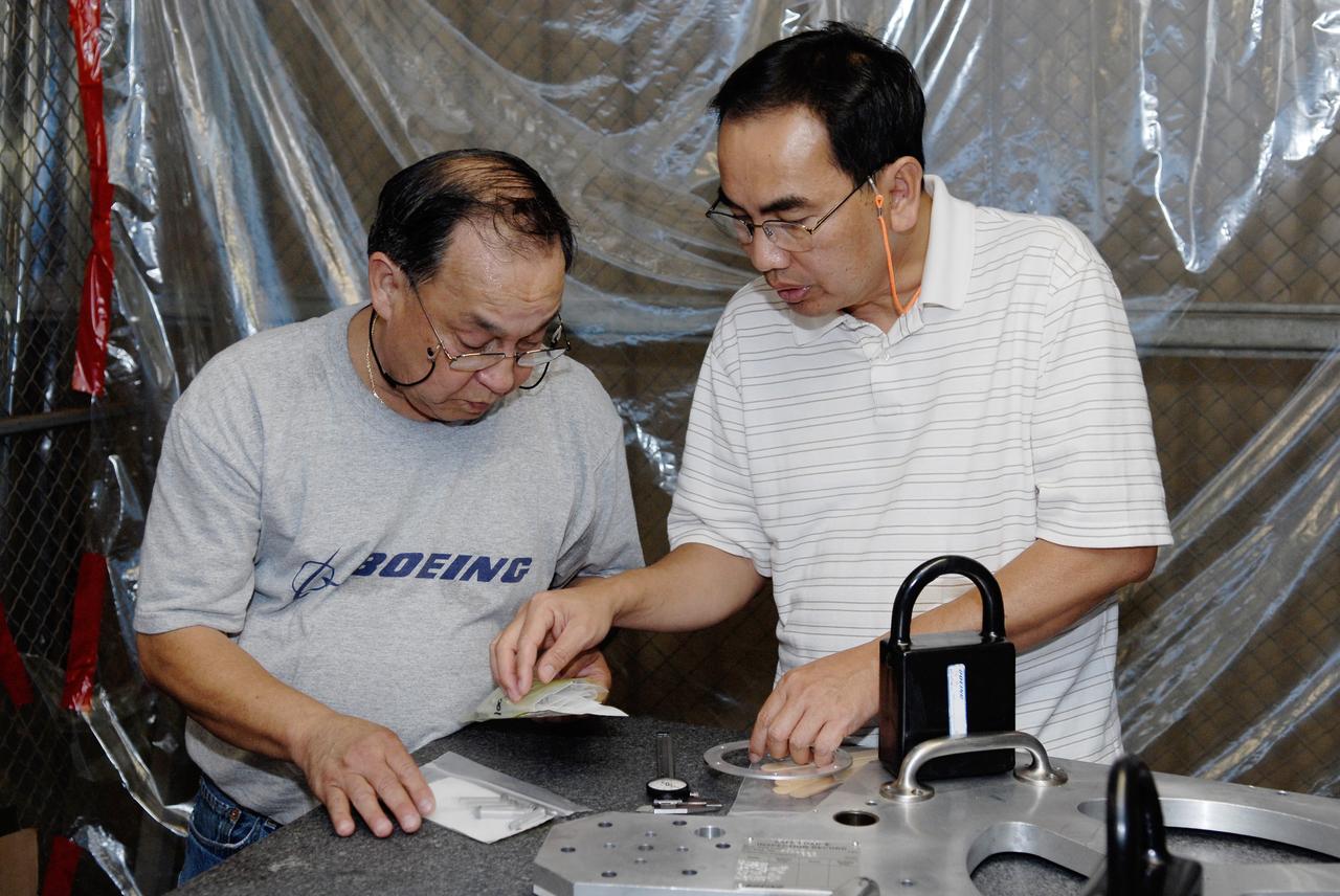CAPE CANAVERAL, Fla. – Inside the Vehicle Assembly Building at NASA's Kennedy Space Center, technicians prepare to replace a valve on Atlantis’ external tank after small dings were found on the sealing surface of the quick disconnect system that handles liquid-hydrogen fuel for the shuttle’s three main engines. The tank will be attached to the twin solid rocket boosters on Aug. 3 for the STS-125 mission, the fifth and final shuttle servicing mission to NASA’s Hubble Space Telescope. During the mission, the crew will install new instruments on the telescope, including the Cosmic Origins Spectrograph and the Wide Field Camera 3. A refurbished Fine Guidance Sensor will replace one unit of three now onboard. Mission specialists will also install new gyroscopes, batteries and thermal blankets on the telescope. Launch is targeted for Oct. 8. Photo credit: NASA/Kim Shiflett
