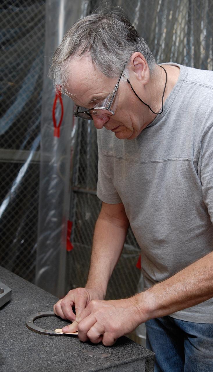CAPE CANAVERAL, Fla. – Inside the Vehicle Assembly Building at NASA's Kennedy Space Center, a technician prepares to replace a valve on Atlantis’ external tank after small dings were found on the sealing surface of the quick disconnect system that handles liquid-hydrogen fuel for the shuttle’s three main engines. The tank will be attached to the twin solid rocket boosters on Aug. 3 for the STS-125 mission, the fifth and final shuttle servicing mission to NASA’s Hubble Space Telescope. During the mission, the crew will install new instruments on the telescope, including the Cosmic Origins Spectrograph and the Wide Field Camera 3. A refurbished Fine Guidance Sensor will replace one unit of three now onboard. Mission specialists will also install new gyroscopes, batteries and thermal blankets on the telescope. Launch is targeted for Oct. 8. Photo credit: NASA/Kim Shiflett