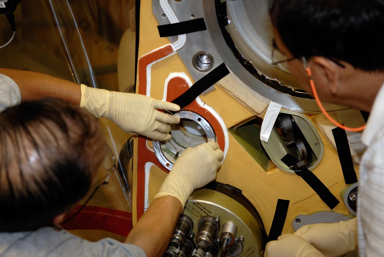CAPE CANAVERAL, Fla. – Inside the Vehicle Assembly Building at NASA's Kennedy Space Center, technicians replace a valve on Atlantis’ external tank after small dings were found on the sealing surface of the quick disconnect system that handles liquid-hydrogen fuel for the shuttle’s three main engines. The tank will be attached to the twin solid rocket boosters on Aug. 3 for the STS-125 mission, the fifth and final shuttle servicing mission to NASA’s Hubble Space Telescope. During the mission, the crew will install new instruments on the telescope, including the Cosmic Origins Spectrograph and the Wide Field Camera 3. A refurbished Fine Guidance Sensor will replace one unit of three now onboard. Mission specialists will also install new gyroscopes, batteries and thermal blankets on the telescope. Launch is targeted for Oct. 8. Photo credit: NASA/Kim Shiflett