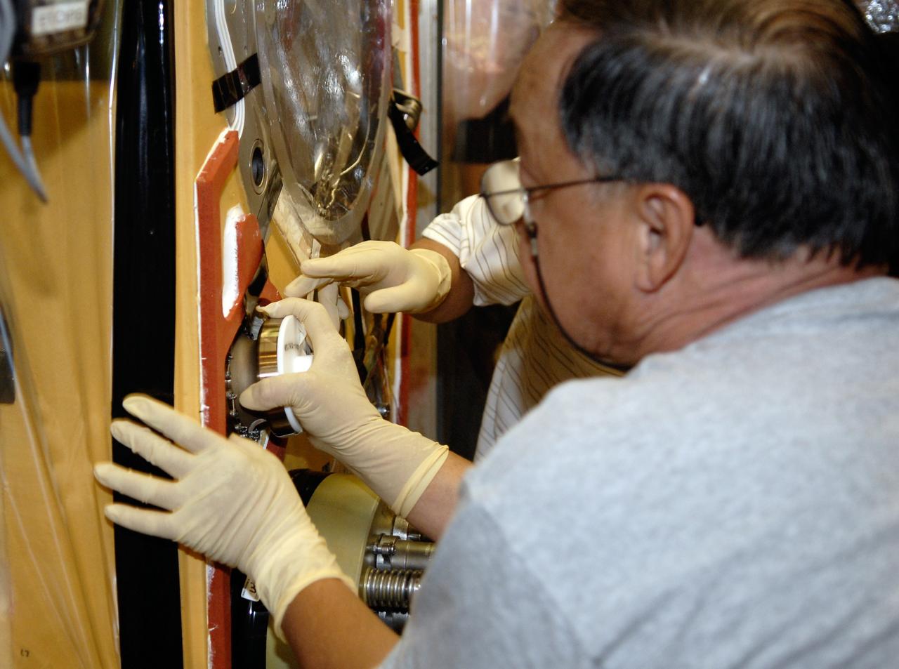 CAPE CANAVERAL, Fla. – Inside the Vehicle Assembly Building at NASA's Kennedy Space Center, technicians replace a valve on Atlantis’ external tank after small dings were found on the sealing surface of the quick disconnect system that handles liquid-hydrogen fuel for the shuttle’s three main engines. The tank will be attached to the twin solid rocket boosters on Aug. 3 for the STS-125 mission, the fifth and final shuttle servicing mission to NASA’s Hubble Space Telescope. During the mission, the crew will install new instruments on the telescope, including the Cosmic Origins Spectrograph and the Wide Field Camera 3. A refurbished Fine Guidance Sensor will replace one unit of three now onboard. Mission specialists will also install new gyroscopes, batteries and thermal blankets on the telescope. Launch is targeted for Oct. 8. Photo credit: NASA/Kim Shiflett