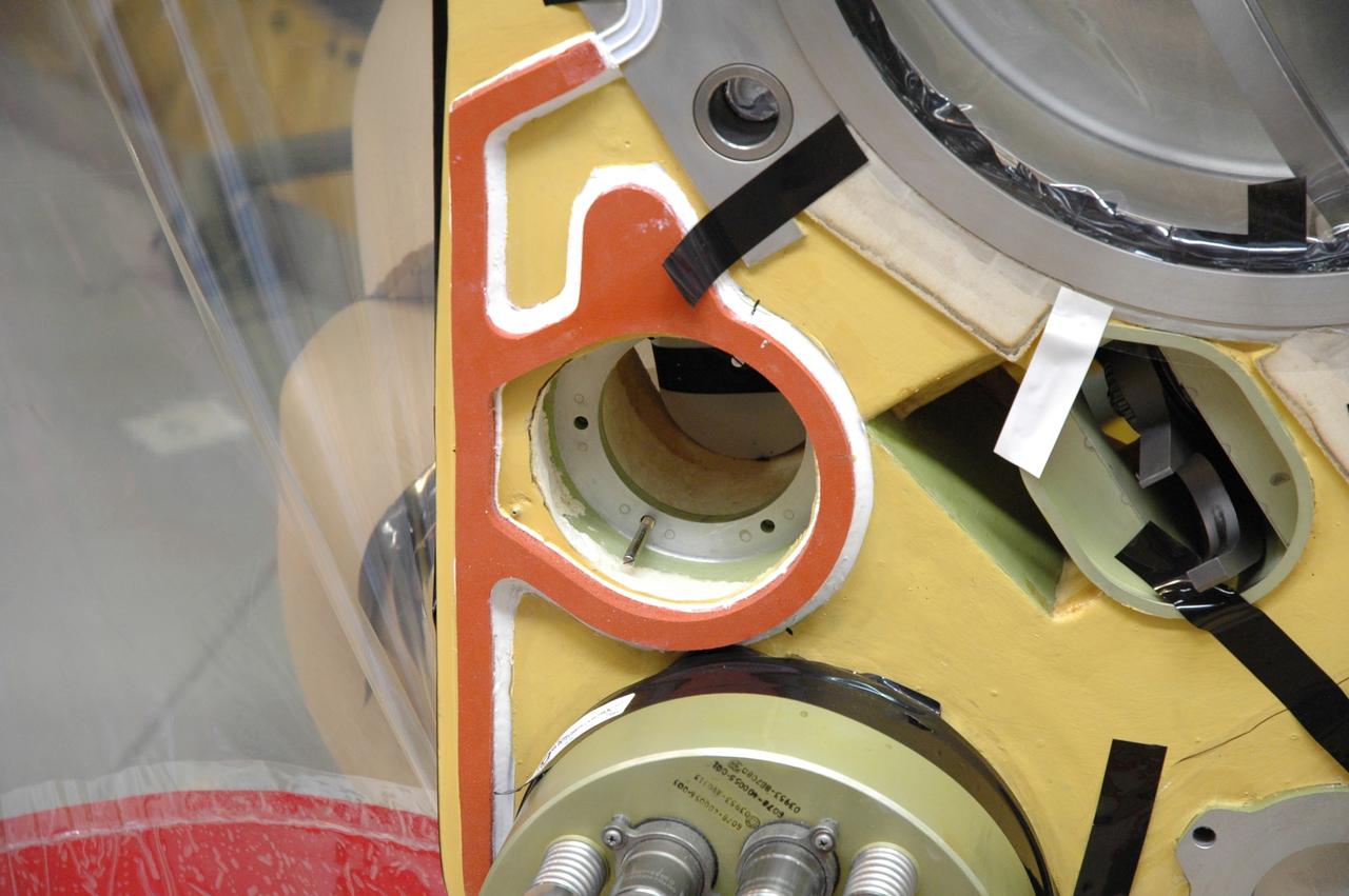 CAPE CANAVERAL, Fla. – A close up view of the quick disconnect system on Atlantis’ external tank inside a test cell in the Vehicle Assembly Building at NASA's Kennedy Space Center. Technicians prepared to replace a valve after small dings were found on the sealing surface of the quick disconnect system that handles liquid-hydrogen fuel for the shuttle’s three main engines. The tank will be attached to the twin solid rocket boosters on Aug. 3 for the STS-125 mission, the fifth and final shuttle servicing mission to NASA’s Hubble Space Telescope. During the mission, the crew will install new instruments on the telescope, including the Cosmic Origins Spectrograph and the Wide Field Camera 3. A refurbished Fine Guidance Sensor will replace one unit of three now onboard. Mission specialists will also install new gyroscopes, batteries and thermal blankets on the telescope. Launch is targeted for Oct. 8. Photo credit: NASA/Jim Grossmann