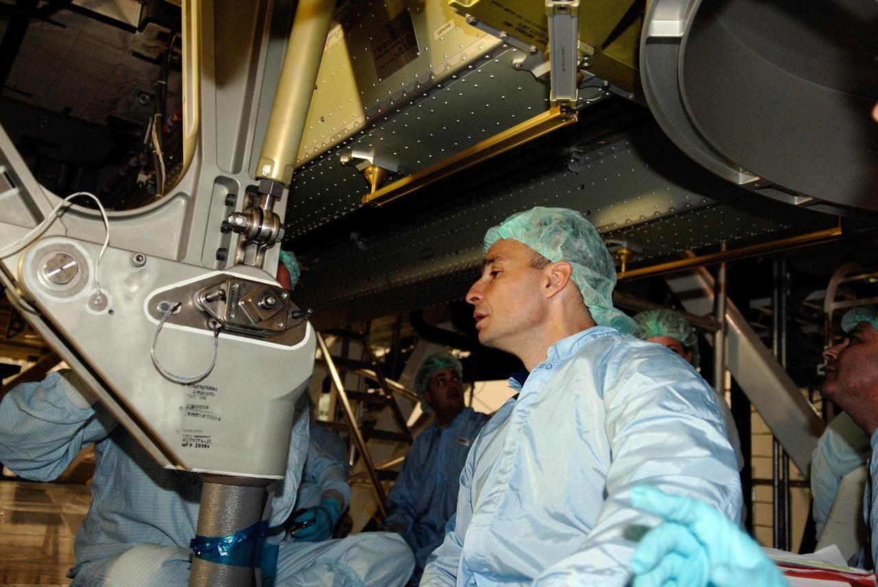 CAPE CANAVERAL, Fla. – In the Space Station Processing Facility at NASA's Kennedy Space Center, STS-119 Commander Lee Archambault inspects hardware slated to fly on his upcoming space shuttle mission.  On the STS-119 mission, space shuttle Discovery will carry the S6 truss segment to complete the 361-foot-long backbone of the International Space Station. The truss includes the fourth pair of solar array wings and electronics that convert sunlight to power for the orbiting laboratory. Launch is targeted for Feb. 12, 2009. Photo credit: NASA/Kim Shiflett