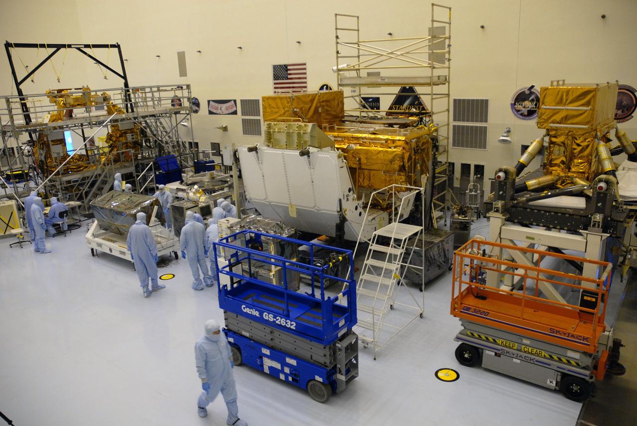 CAPE CANAVERAL, Fla. – At NASA's Kennedy Space Center, workers from NASA's Goddard Space Flight Center roll the Cosmic Origins Spectrograph, or COS, into position in the clean room of the Payload Hazardous Servicing Facility for instrument testing and integration with the Flight Support System carrier. The COS will be installed on the Hubble Space Telescope on space shuttle Atlantis' STS-125 mission.  COS will be the most sensitive ultraviolet spectrograph ever flown on Hubble and will probe the "cosmic web" - the large-scale structure of the universe whose form is determined by the gravity of dark matter and is traced by galaxies and intergalactic gas.  COS's far-ultraviolet channel has a sensitivity 30 times greater than that of previous spectroscopic instruments for the detection of extremely low light levels.  Launch of STS-125 is targeted for Oct. 8.  Photo credit: NASA/Jack Pfaller